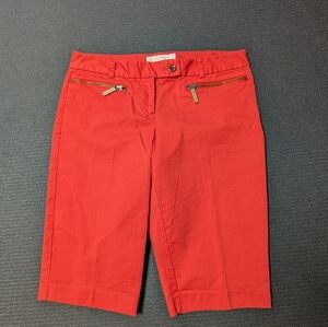 Bright coral colored long walking shorts by Michael Michael Kors. Size 4.
